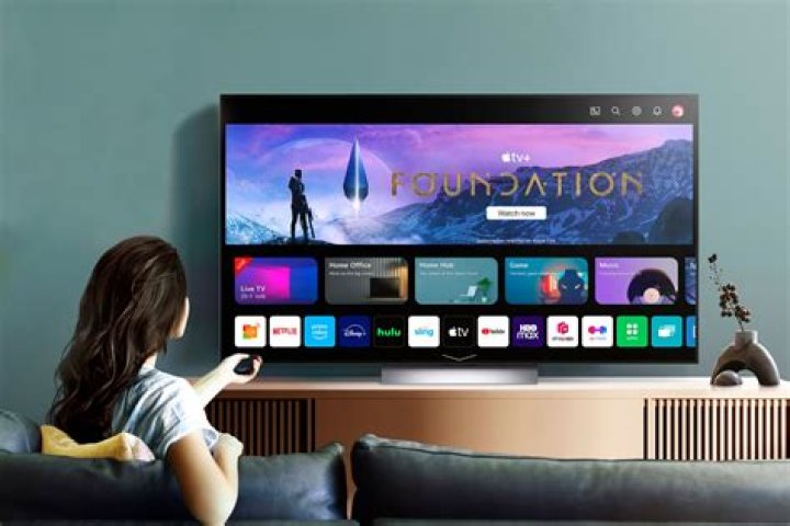 How can I watch my Apple laptop on my smart TV?