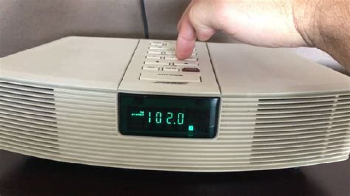 How do I brighten the clock on my Bose radio?