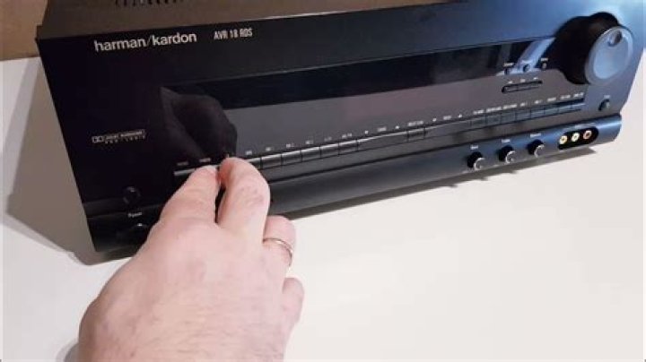 How do I reset my Harman Kardon amp?