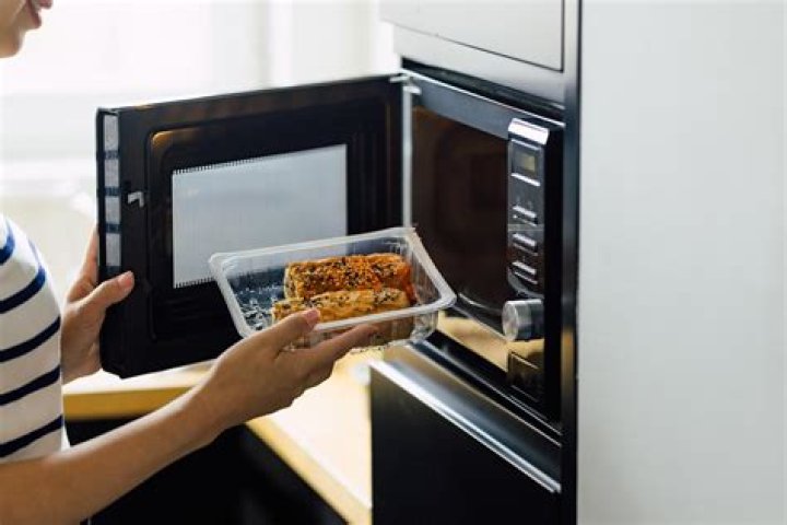 Why should you be careful when microwaving cheese?